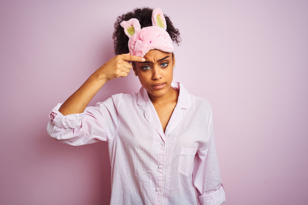 Young,African,American,Woman,Wearing,Pajama,And,Mask,Over,Isolated