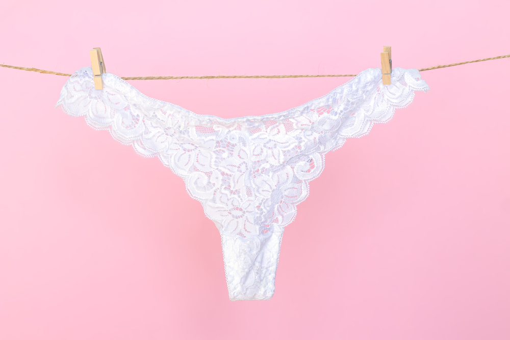 Female,White,Sexy,Lace,Panties,Hanging,On,Clothesline,On,Pink