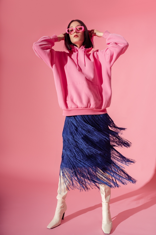 Fashionable,Confident,Woman,Wearing,Trendy,Pink,Hoodie,,Glasses,,Blue,Fringed skirt