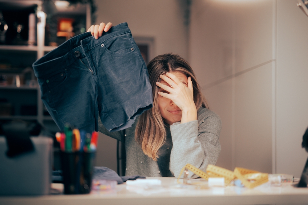 Unhappy,Woman,Trying,To,Shorten,Her,Old,Pants,Ruining,Them