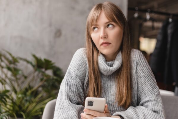 Confused,Puzzled,Blonde,Bang,Woman,In,Casual,Clothes,,Sits,In