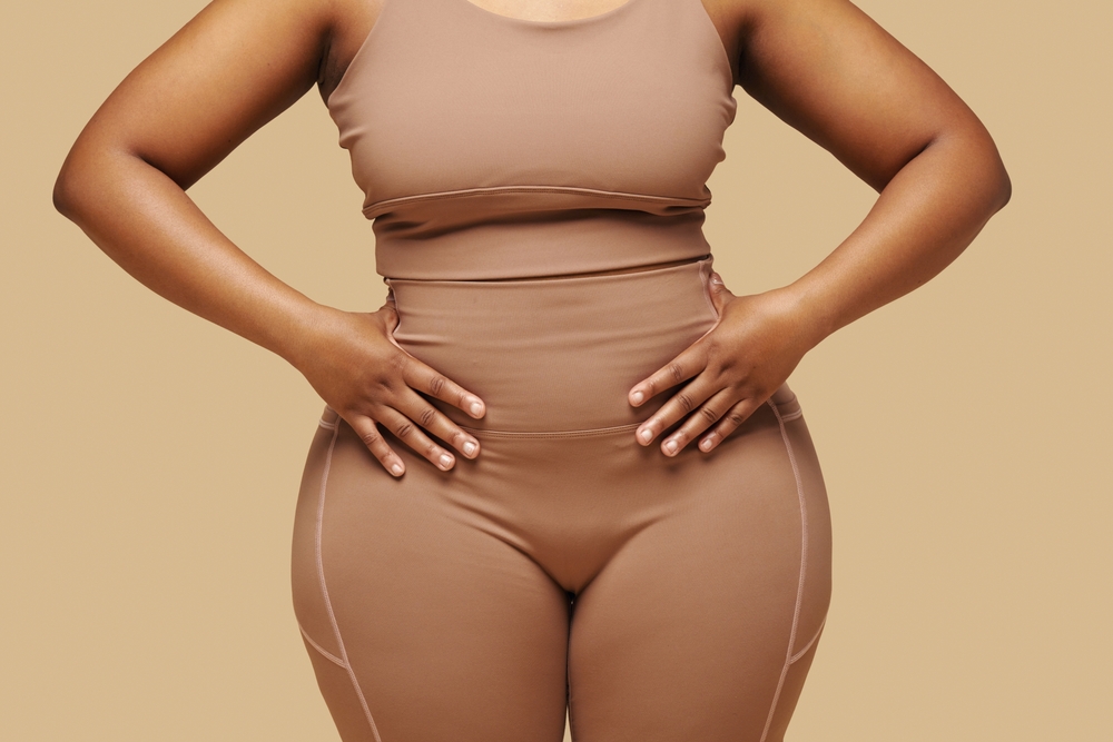 Cropped,Image,Of,Curvy,Black,Woman,Putting,Hands,On,Waist