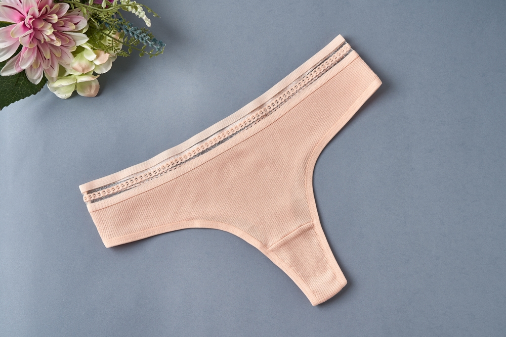 Women's,Underwear,,Pink,Thong,On,Gray,Background