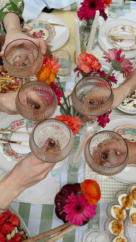 Toasting,Over,A,Beautifully,Styled,Garden,Party,Tablescape.,A,Perfect